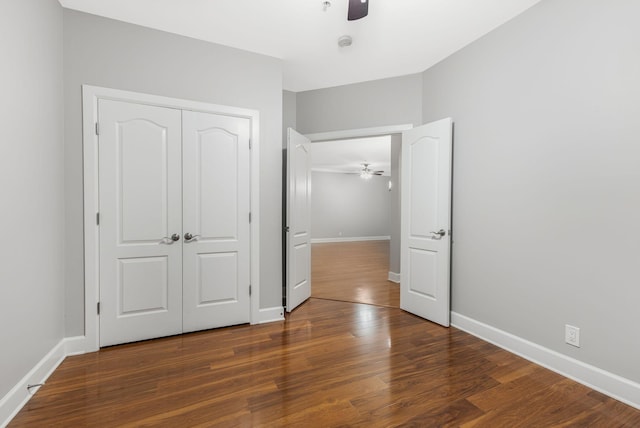 307 Seven Springs Way Unit 103, Brentwood, TN 37027 - unfurnished bedroom with wood finished floors, a closet, and a ceiling fan