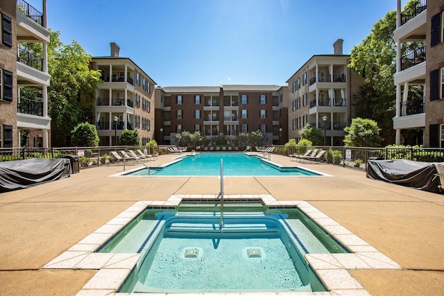 307 Seven Springs Way Unit 103, Brentwood, TN 37027 - community pool with a community hot tub and a patio