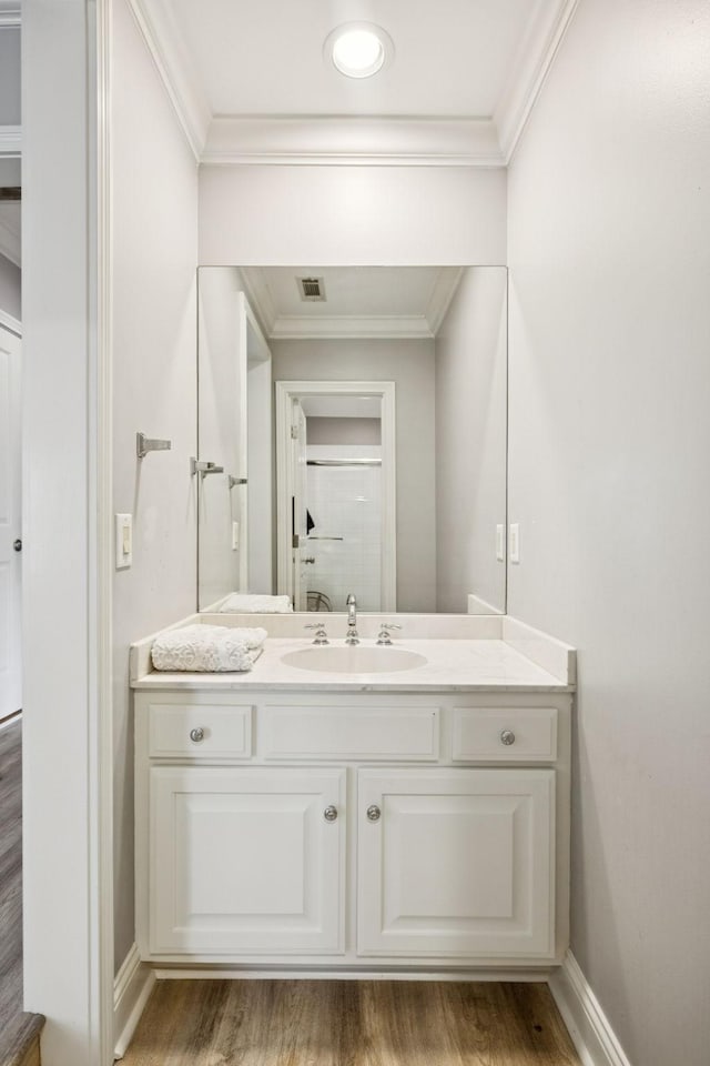 216 Bramerton Ct, Franklin, TN 37069 - bathroom with ornamental molding, vanity, and wood finished floors