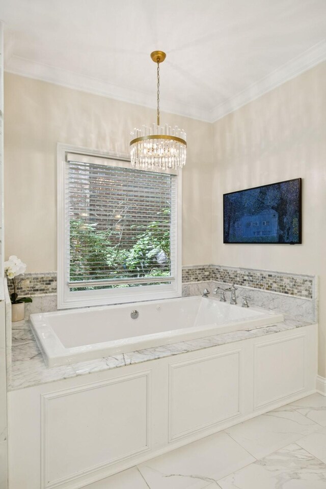 216 Bramerton Ct, Franklin, TN 37069 - full bath featuring a chandelier, a garden tub, ornamental molding, and marble look tiles