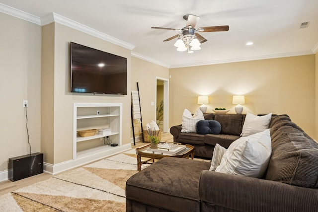 216 Bramerton Ct, Franklin, TN 37069 - living room featuring wood finished floors, a ceiling fan, built in shelves, ornamental molding, and recessed lighting