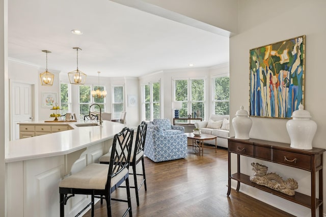 216 Bramerton Ct, Franklin, TN 37069 - living area with ornamental molding, dark wood-style floors, recessed lighting, and a chandelier