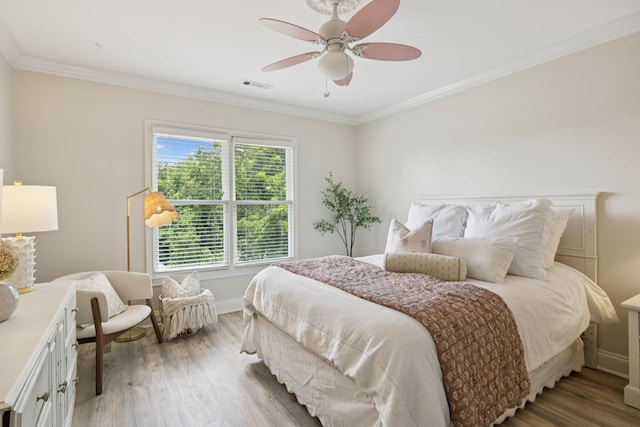 216 Bramerton Ct, Franklin, TN 37069 - bedroom with light wood-style flooring, crown molding, and a ceiling fan