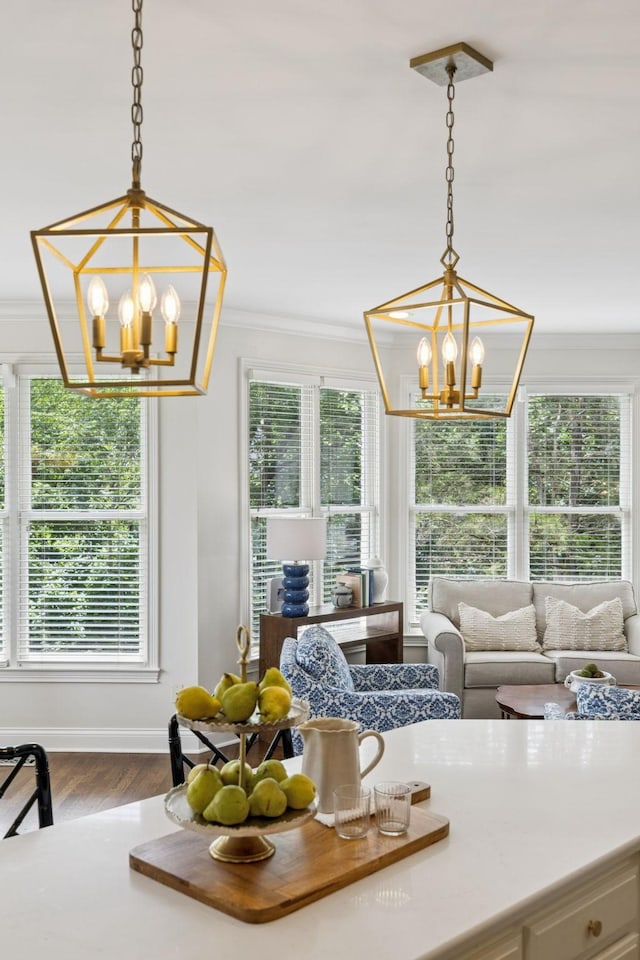 216 Bramerton Ct, Franklin, TN 37069 - dining space with a chandelier, crown molding, dark wood-type flooring, and plenty of natural light
