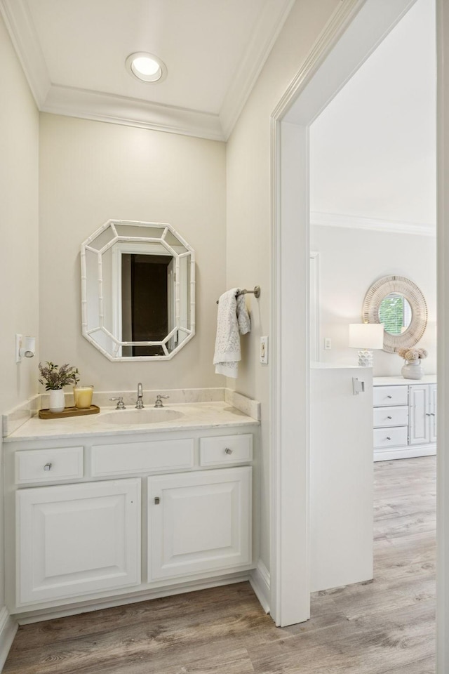 216 Bramerton Ct, Franklin, TN 37069 - bathroom with ornamental molding, vanity, wood finished floors, and recessed lighting