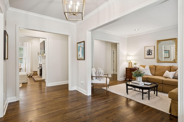 216 Bramerton Ct, Franklin, TN 37069 - living area featuring a chandelier, dark wood finished floors, ornamental molding, and a fireplace with raised hearth