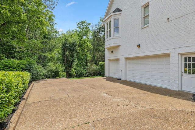 216 Bramerton Ct, Franklin, TN 37069 - garage featuring driveway