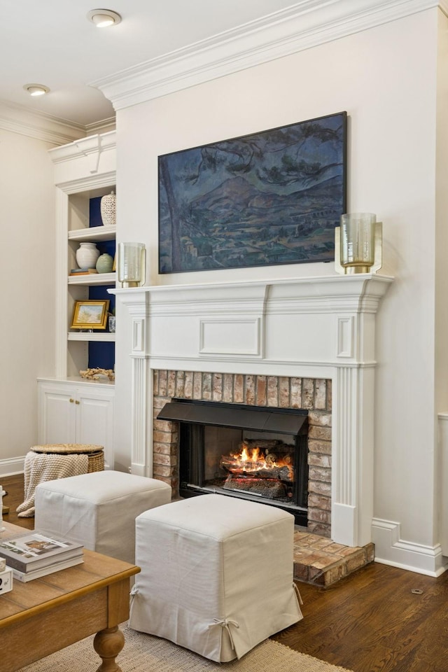 216 Bramerton Ct, Franklin, TN 37069 - detailed view of a brick fireplace, crown molding, wood finished floors, and built in shelves