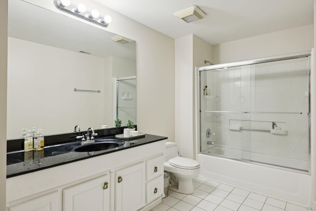 216 Bramerton Ct, Franklin, TN 37069 - full bath featuring tile patterned flooring, vanity, and shower / bath combination with glass door