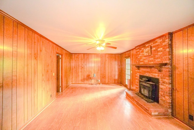 1094B Center Point Rd, Hendersonville, TN 37075 - unfurnished living room featuring a ceiling fan, light wood-type flooring, wooden walls, and crown molding