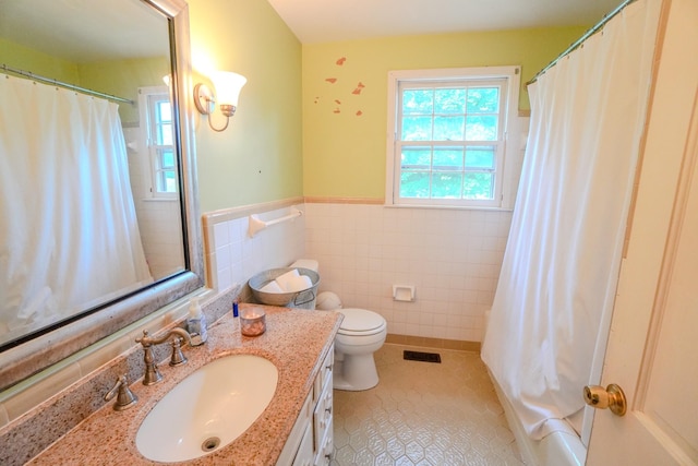1094B Center Point Rd, Hendersonville, TN 37075 - bathroom featuring tile walls, healthy amount of natural light, vanity, tile patterned flooring, and wainscoting