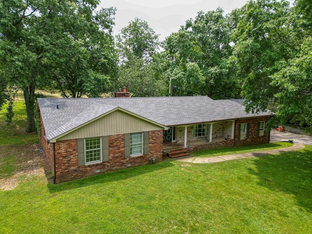 1094B Center Point Rd, Hendersonville, TN 37075 - ranch-style house with roof with shingles, brick siding, covered porch, a front lawn, and a chimney