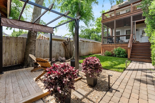 1708A 7th Ave N, Nashville, TN 37208 - wooden deck featuring a fenced backyard, a pergola, a sunroom, ceiling fan, and stairs