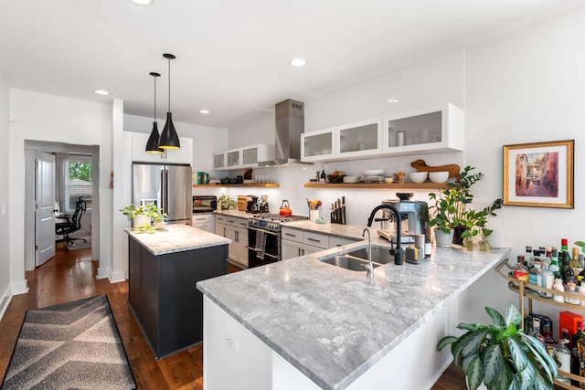 1708A 7th Ave N, Nashville, TN 37208 - kitchen with stainless steel appliances, island range hood, a peninsula, light stone counters, and glass insert cabinets
