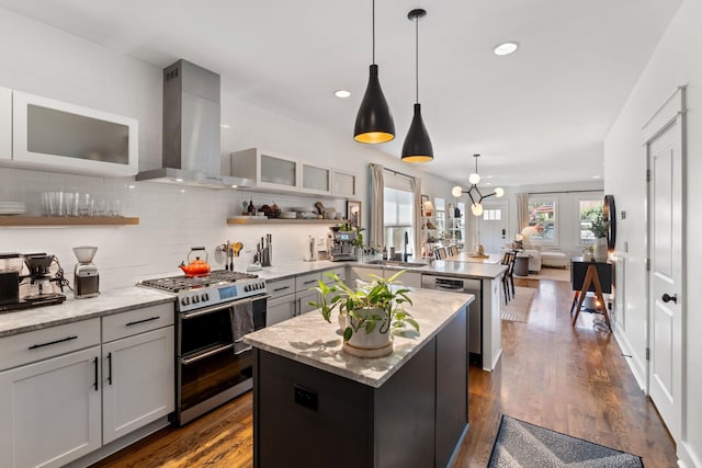 1708A 7th Ave N, Nashville, TN 37208 - kitchen with appliances with stainless steel finishes, wall chimney exhaust hood, a peninsula, open shelves, and backsplash