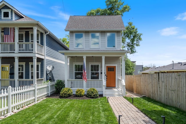 1708A 7th Ave N, Nashville, TN 37208 - view of front of house featuring covered porch, a fenced backyard, and roof with shingles