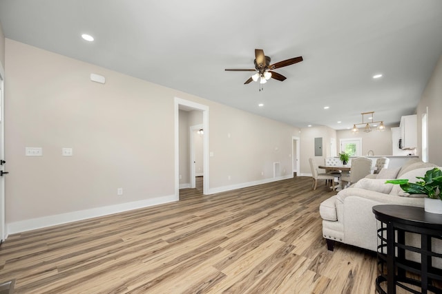 223 Patriot Ln, Estill Springs, TN 37330 - living area featuring light wood finished floors, a ceiling fan, electric panel, and recessed lighting