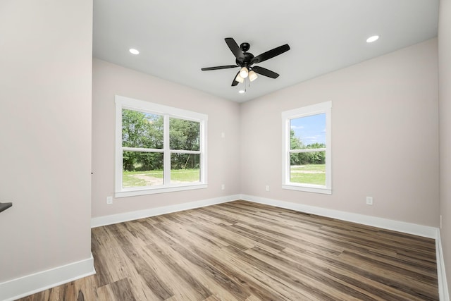 223 Patriot Ln, Estill Springs, TN 37330 - empty room with healthy amount of natural light, wood finished floors, a ceiling fan, and recessed lighting