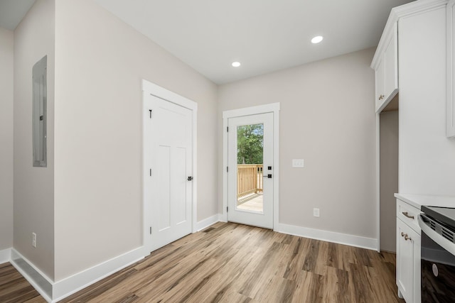 223 Patriot Ln, Estill Springs, TN 37330 - kitchen with electric stove, light wood-type flooring, white cabinetry, light countertops, and recessed lighting