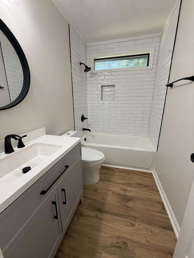 1012 Hollis Ln, White House, TN 37188 - bathroom with vanity, tub / shower combination, and wood finished floors