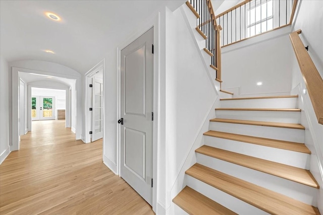 1516 Forest Ave, Nashville, TN 37206 - staircase with wood finished floors, vaulted ceiling, and arched walkways