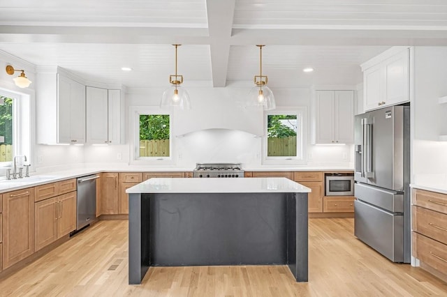 1516 Forest Ave, Nashville, TN 37206 - kitchen with stainless steel appliances, light wood-type flooring, healthy amount of natural light, light countertops, and beamed ceiling