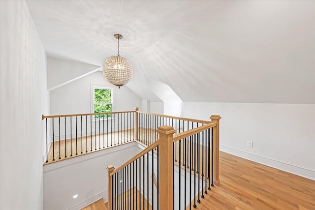 1516 Forest Ave, Nashville, TN 37206 - stairs with a chandelier, wood finished floors, and lofted ceiling