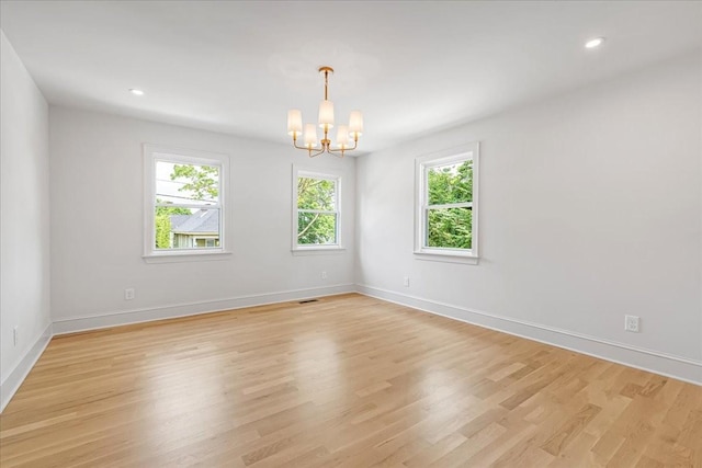 1516 Forest Ave, Nashville, TN 37206 - spare room with a chandelier, light wood-type flooring, and recessed lighting