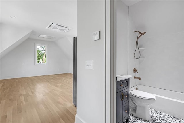 1516 Forest Ave, Nashville, TN 37206 - full bath with wood finished floors, lofted ceiling, washtub / shower combination, and vanity