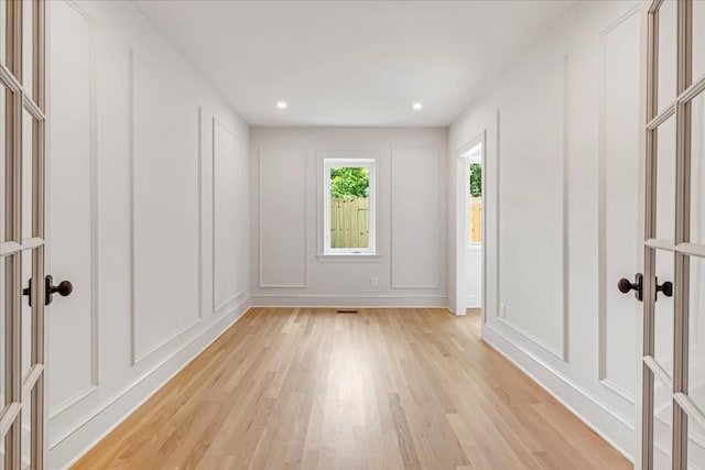 1516 Forest Ave, Nashville, TN 37206 - empty room with a decorative wall, light wood-type flooring, and recessed lighting