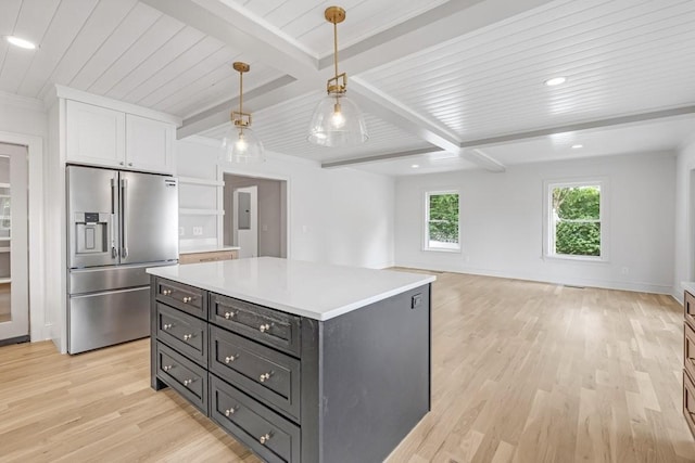 1516 Forest Ave, Nashville, TN 37206 - kitchen with high end fridge, white cabinets, light wood-type flooring, light countertops, and pendant lighting