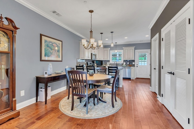 4313 Glasgow Rd, Spring Hill, TN 37174 - dining area featuring crown molding, a chandelier, light wood finished floors, and recessed lighting