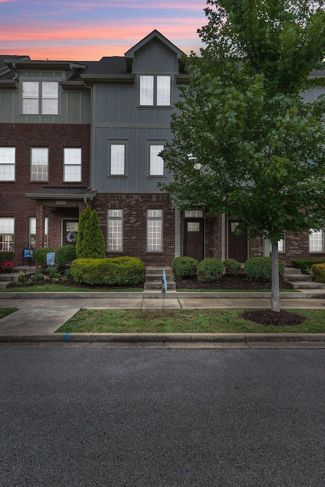 4313 Glasgow Rd, Spring Hill, TN 37174 - view of front of house featuring board and batten siding and brick siding