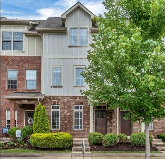 4313 Glasgow Rd, Spring Hill, TN 37174 - view of front facade featuring board and batten siding and brick siding