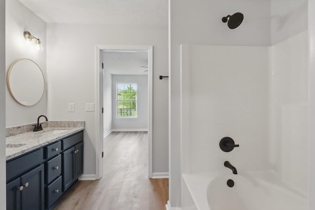 2717 Cayuga Dr, Murfreesboro, TN 37130 - bathroom featuring wood finished floors, double vanity, and bathtub / shower combination