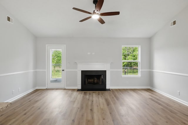 2717 Cayuga Dr, Murfreesboro, TN 37130 - unfurnished living room featuring wood finished floors, ceiling fan, and a fireplace with flush hearth