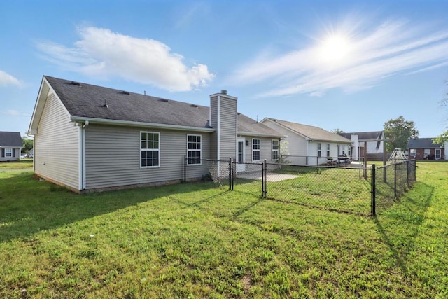 2717 Cayuga Dr, Murfreesboro, TN 37130 - back of property with a chimney, roof with shingles, and a gate