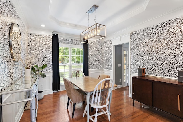 2507 Patricia Cir, Murfreesboro, TN 37128 - dining space featuring a raised ceiling, crown molding, wood-type flooring, a decorative wall, and a wainscoted wall