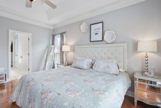 2507 Patricia Cir, Murfreesboro, TN 37128 - bedroom featuring ornamental molding, wood finished floors, a raised ceiling, connected bathroom, and ceiling fan