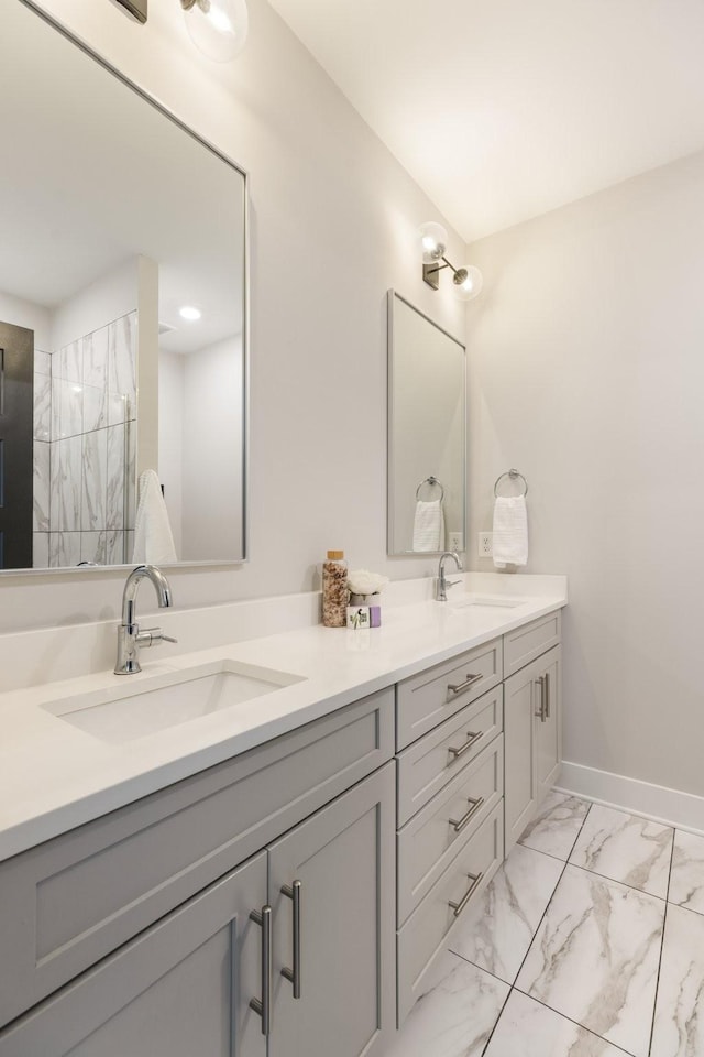 801 Cherokee Ave Apt 6, Nashville, TN 37207 - bathroom featuring double vanity and marble look tile flooring