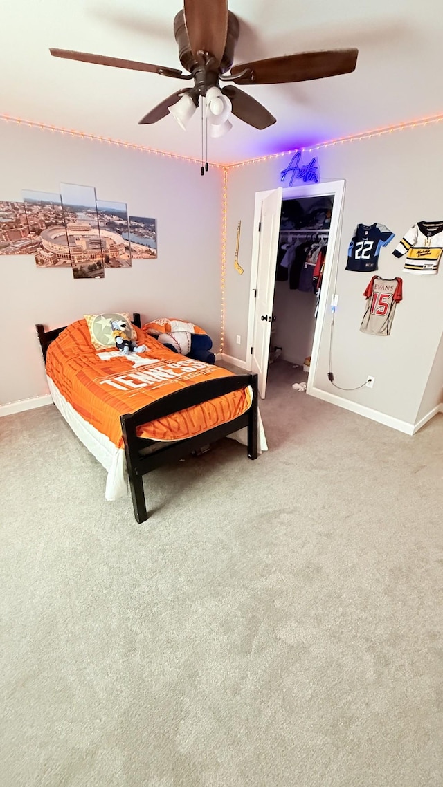 899 Sneed Blvd, Lafayette, TN 37083 - bedroom with light carpet, a ceiling fan, and a walk in closet