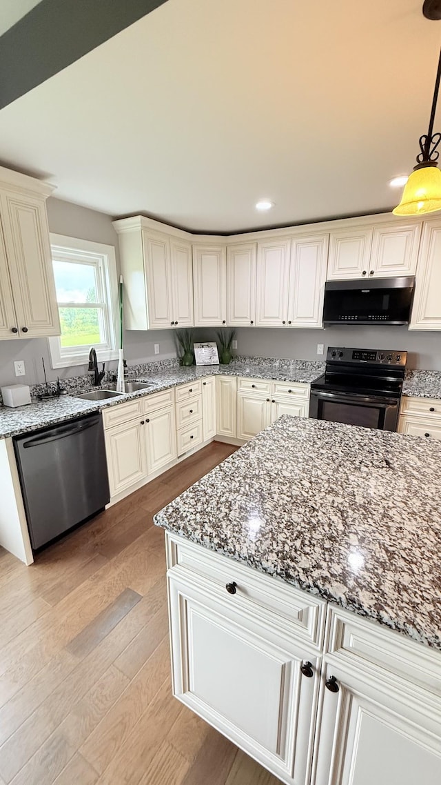 899 Sneed Blvd, Lafayette, TN 37083 - kitchen with black appliances, light wood-type flooring, light stone countertops, pendant lighting, and recessed lighting