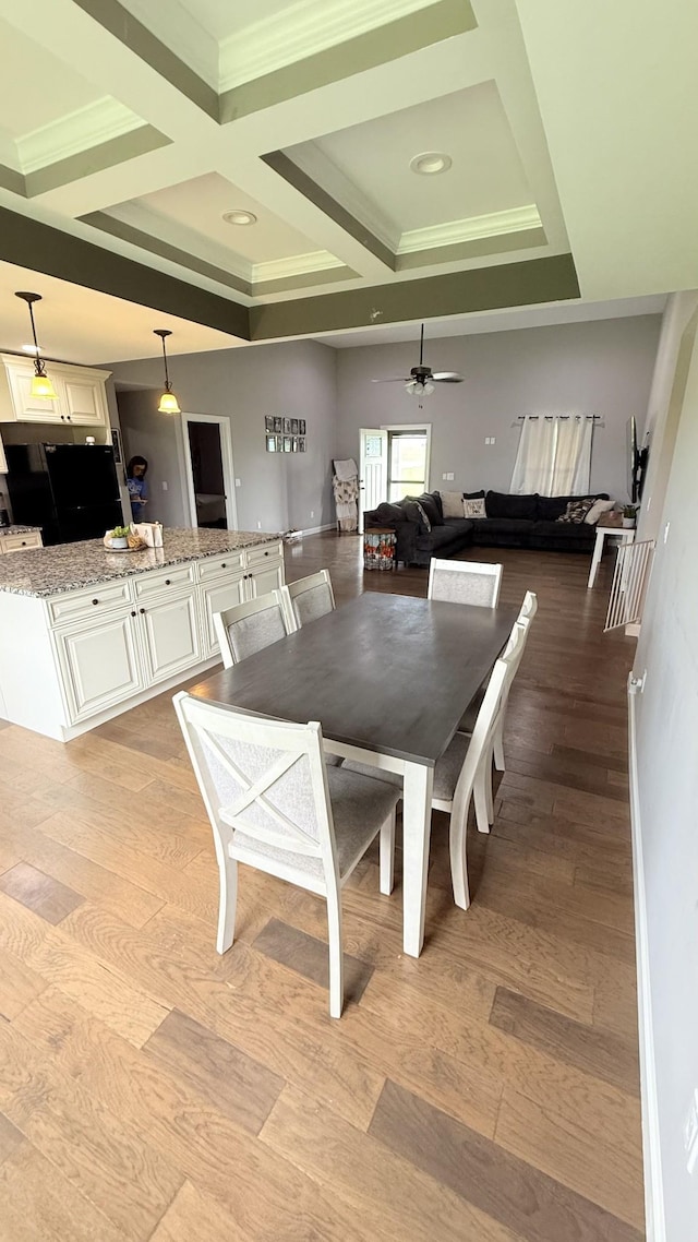 899 Sneed Blvd, Lafayette, TN 37083 - dining room with light wood finished floors, coffered ceiling, ornamental molding, ceiling fan, and beam ceiling