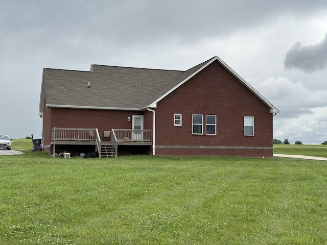 899 Sneed Blvd, Lafayette, TN 37083 - back of house featuring brick siding, a deck, a lawn, and roof with shingles