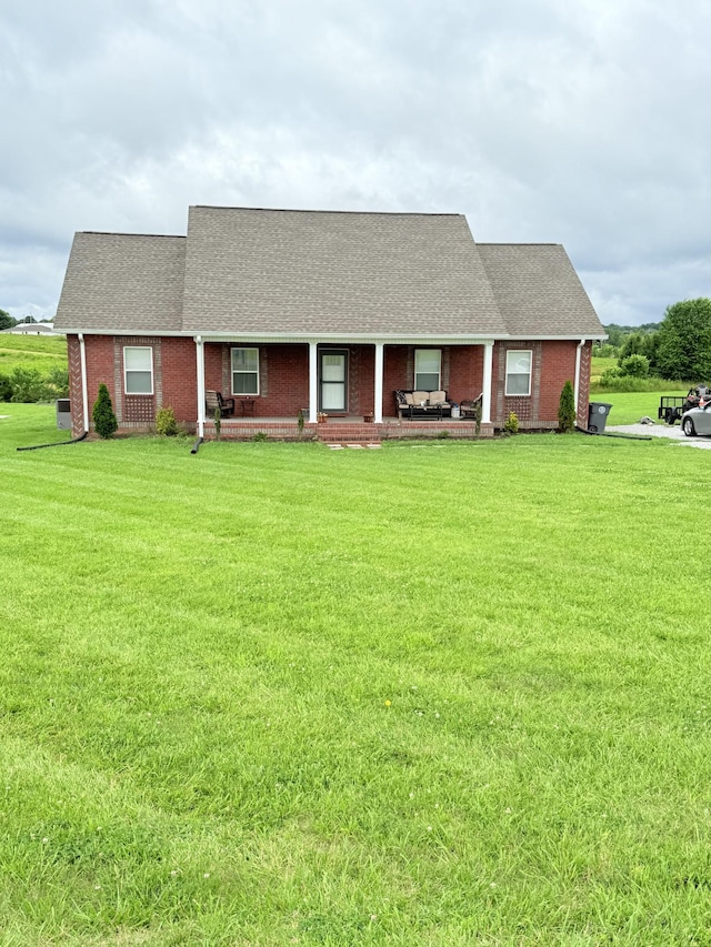 899 Sneed Blvd, Lafayette, TN 37083 - view of front of property featuring a porch, a front yard, brick siding, and a shingled roof
