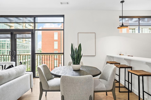 1002 Division St Unit 403, Nashville, TN 37203 - dining room featuring french doors and light wood-style floors
