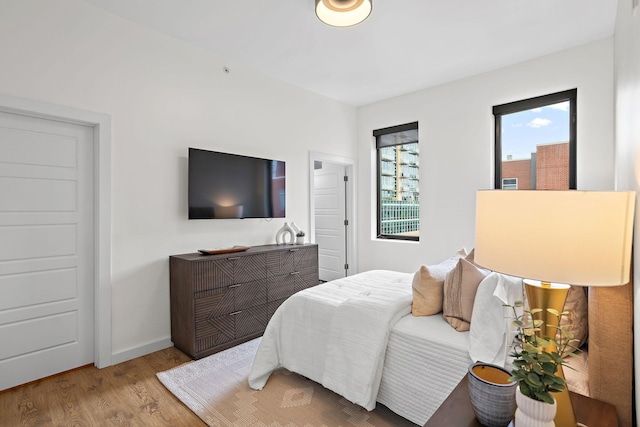 1002 Division St Unit 403, Nashville, TN 37203 - bedroom featuring wood finished floors and baseboards