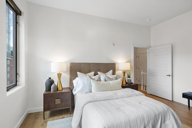 1002 Division St Unit 403, Nashville, TN 37203 - bedroom with wood finished floors