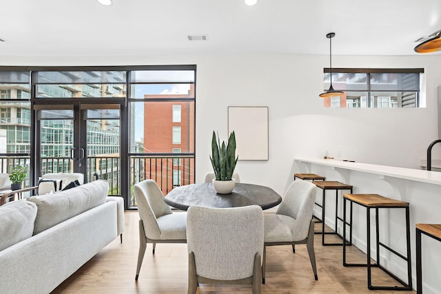 1002 Division St Unit 403, Nashville, TN 37203 - dining room with light wood-type flooring, recessed lighting, and french doors