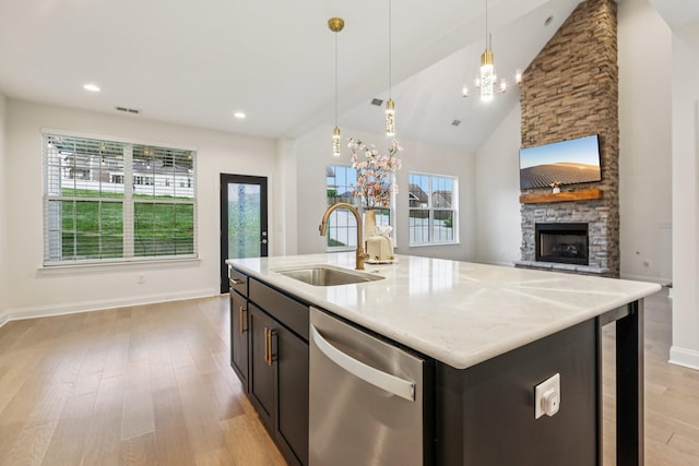 6807 Kew Gdn, Smyrna, TN 37167 - kitchen with dishwasher, light wood finished floors, a stone fireplace, hanging light fixtures, and beverage cooler